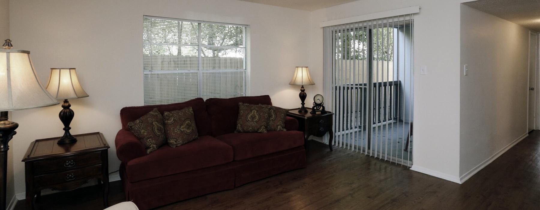 a living room with a wood floor